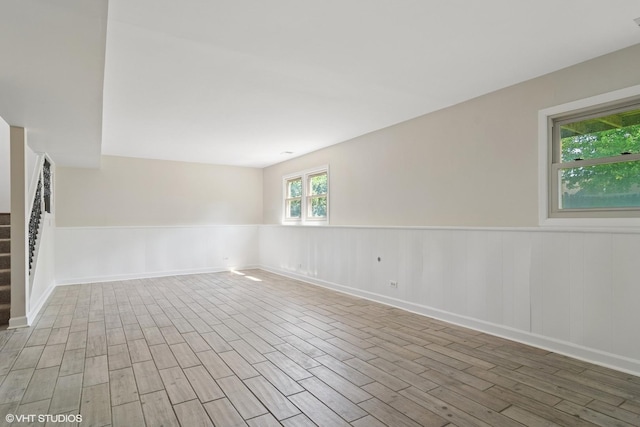 4325 Sandlewood Ln, Hoffman Estates, IL 60192 - empty room with wood finished floors, a wainscoted wall, and stairway