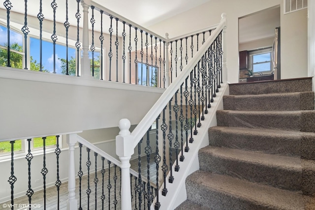 4325 Sandlewood Ln, Hoffman Estates, IL 60192 - staircase with healthy amount of natural light and a towering ceiling