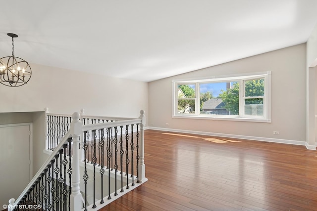 4325 Sandlewood Ln, Hoffman Estates, IL 60192 - hall featuring a chandelier, an upstairs landing, vaulted ceiling, and wood finished floors