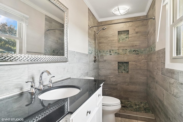 4325 Sandlewood Ln, Hoffman Estates, IL 60192 - bathroom with tile walls, tiled shower, vanity, and crown molding