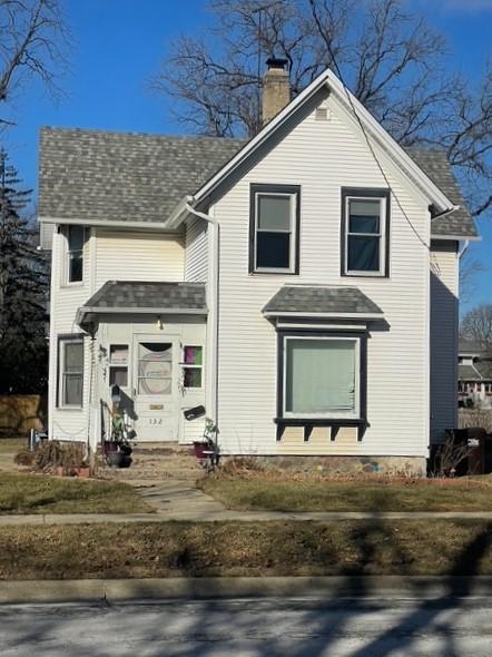 132 S Mchenry Ave, Crystal Lake, IL 60014 - view of front of house featuring a chimney and roof with shingles