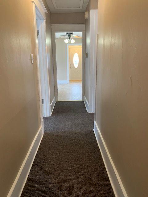 132 S Mchenry Ave, Crystal Lake, IL 60014 - hall featuring dark colored carpet and baseboards