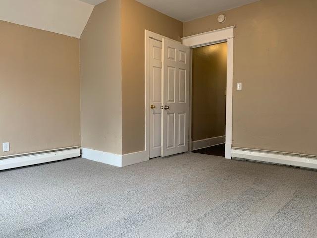 132 S Mchenry Ave, Crystal Lake, IL 60014 - additional living space with a baseboard heating unit, carpet floors, and a baseboard radiator