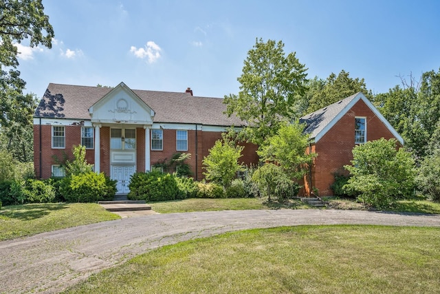 20020 Western Ave, Olympia Fields, IL 60461 - greek revival house with a front yard and brick siding