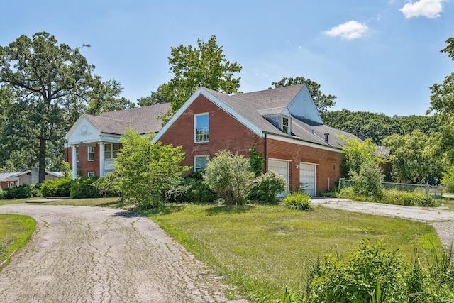 20020 Western Ave, Olympia Fields, IL 60461 - view of front of home with driveway, brick siding, an attached garage, and a front yard