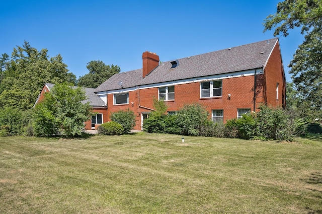 20020 Western Ave, Olympia Fields, IL 60461 - back of property with a chimney, a lawn, brick siding, and roof with shingles