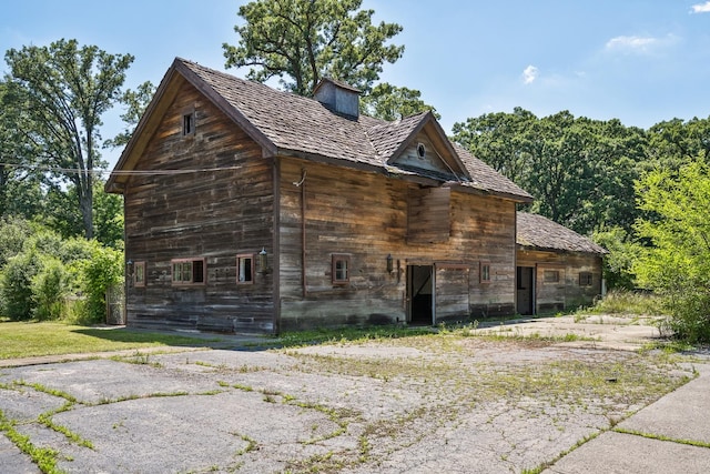 20020 Western Ave, Olympia Fields, IL 60461 - view of side of home with a barn, an outbuilding, and a chimney