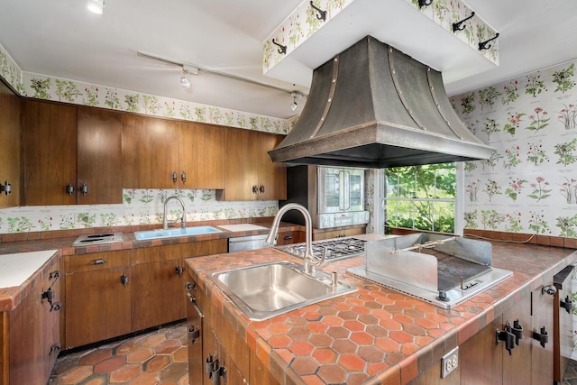 20020 Western Ave, Olympia Fields, IL 60461 - kitchen with island exhaust hood, wallpapered walls, track lighting, brown cabinets, and decorative backsplash