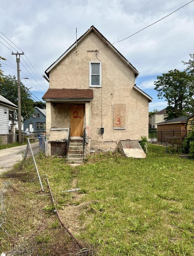 8636 S Union Ave, Chicago, IL 60620 - rear view of house featuring stucco siding and entry steps