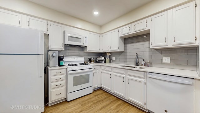 2328 Sedgfield Ct, Schaumburg, IL 60194 - kitchen with white appliances, light countertops, decorative backsplash, white cabinetry, and light wood-style floors