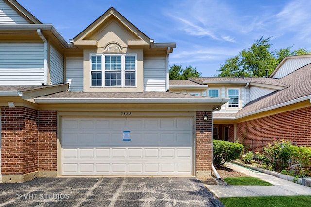 2328 Sedgfield Ct, Schaumburg, IL 60194 - view of front of property with brick siding, driveway, and an attached garage