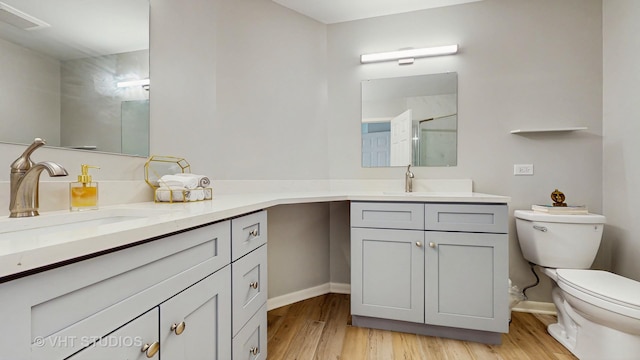 2328 Sedgfield Ct, Schaumburg, IL 60194 - bathroom featuring wood finished floors, vanity, and a shower