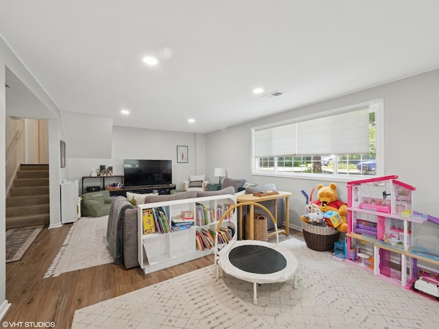 1339 Fowler Ave, Evanston, IL 60201 - game room with wood finished floors and recessed lighting