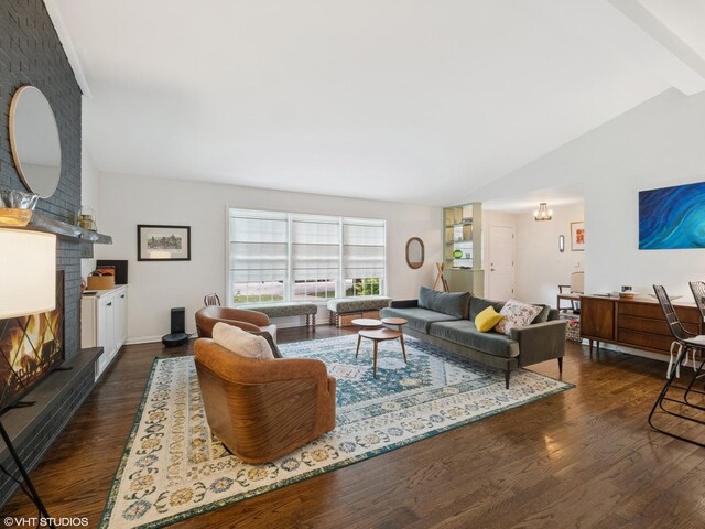 1339 Fowler Ave, Evanston, IL 60201 - living area with dark wood-style floors, a brick fireplace, and vaulted ceiling