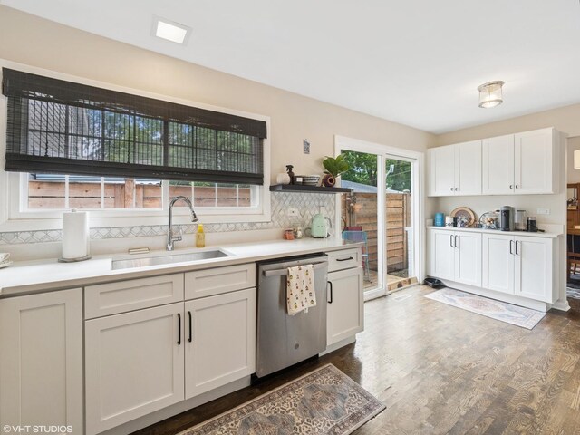 1339 Fowler Ave, Evanston, IL 60201 - kitchen featuring dishwasher, decorative backsplash, wood finished floors, white cabinets, and light countertops