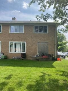 41 Mccarthy Rd, Park Forest, IL 60466 - back of house with a lawn