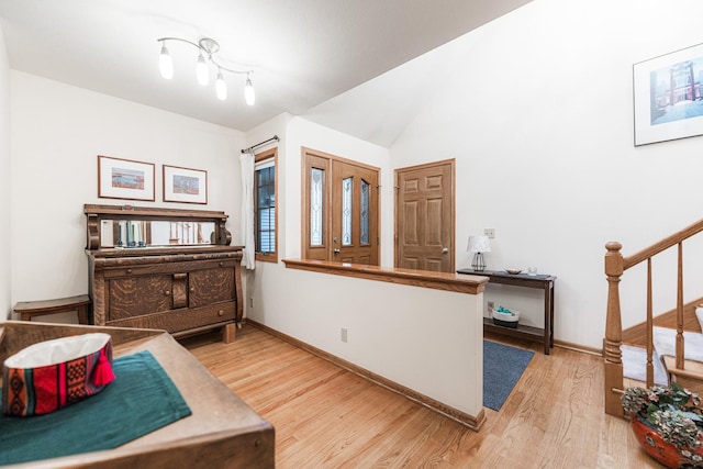 4 Meadow Trl W, Dekalb, IL 60115 - sitting room with wood finished floors, stairway, and lofted ceiling
