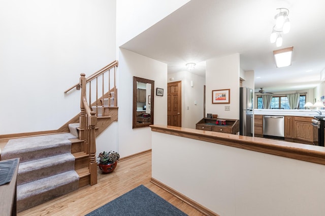 4 Meadow Trl W, Dekalb, IL 60115 - staircase with wood finished floors and baseboards