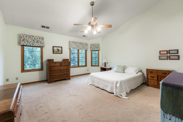 4 Meadow Trl W, Dekalb, IL 60115 - bedroom featuring light carpet, lofted ceiling, and ceiling fan