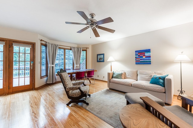 4 Meadow Trl W, Dekalb, IL 60115 - living room with plenty of natural light, ceiling fan, and light wood-style floors
