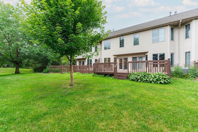 4 Meadow Trl W, Dekalb, IL 60115 - rear view of house with a yard and a deck