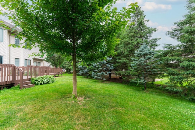4 Meadow Trl W, Dekalb, IL 60115 - view of grassy yard with a deck