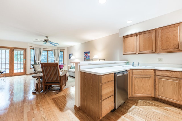 4 Meadow Trl W, Dekalb, IL 60115 - kitchen with stainless steel dishwasher, light wood finished floors, light countertops, a ceiling fan, and recessed lighting