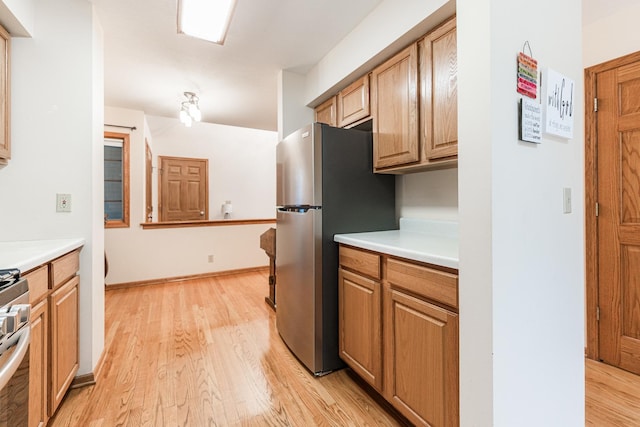 4 Meadow Trl W, Dekalb, IL 60115 - kitchen with appliances with stainless steel finishes, light wood-style flooring, and light countertops