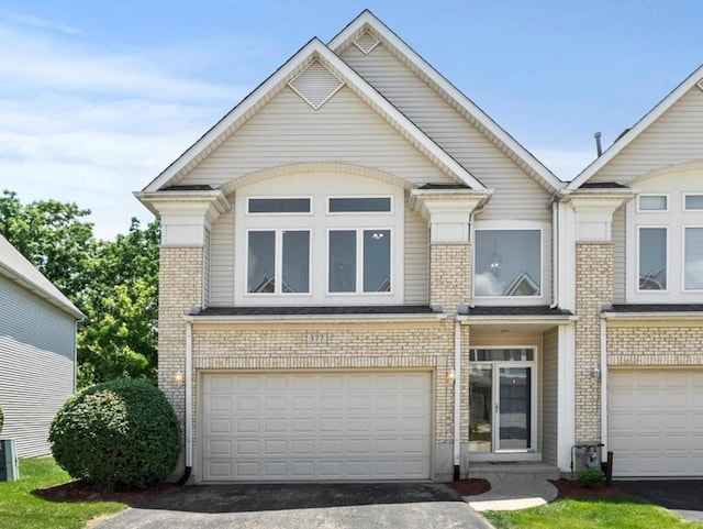 377 Aaron Ln, Bolingbrook, IL 60440 - view of front of house with brick siding, driveway, and an attached garage
