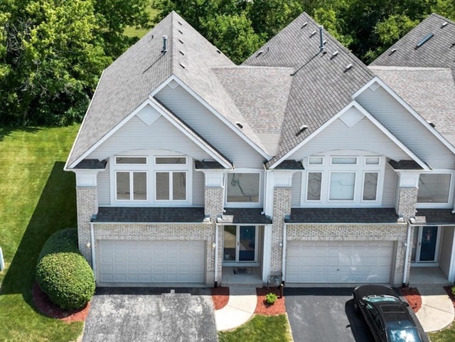 377 Aaron Ln, Bolingbrook, IL 60440 - view of front facade featuring an attached garage, asphalt driveway, and roof with shingles