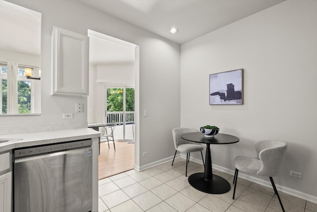 377 Aaron Ln, Bolingbrook, IL 60440 - kitchen featuring stainless steel dishwasher, light countertops, white cabinets, light tile patterned floors, and recessed lighting