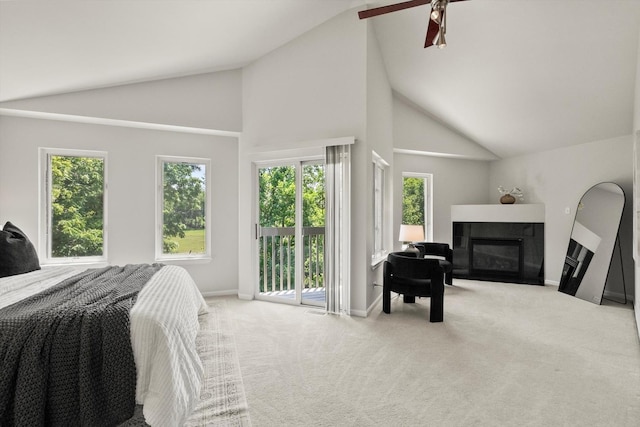 377 Aaron Ln, Bolingbrook, IL 60440 - bedroom with access to outside, a glass covered fireplace, carpet, a ceiling fan, and high vaulted ceiling