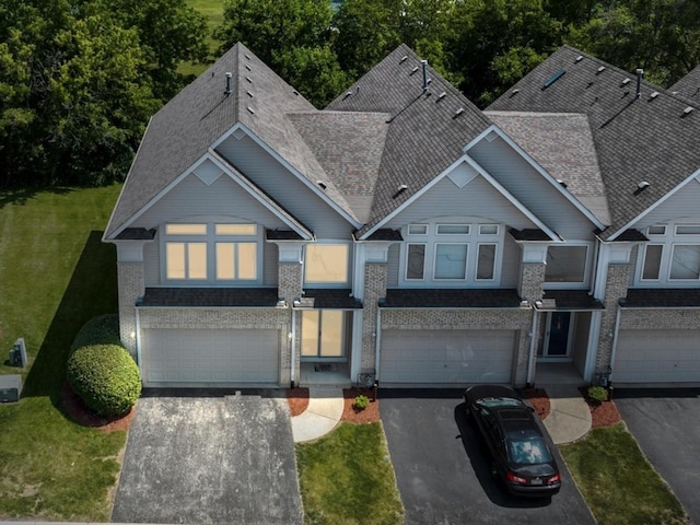 377 Aaron Ln, Bolingbrook, IL 60440 - view of front of property featuring a garage, concrete driveway, a shingled roof, and a front lawn