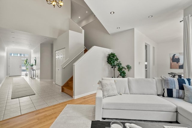 377 Aaron Ln, Bolingbrook, IL 60440 - living area with stairs, recessed lighting, light wood-style floors, and a high ceiling