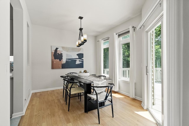 377 Aaron Ln, Bolingbrook, IL 60440 - dining space featuring light wood-style flooring and a chandelier