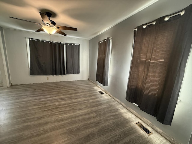 310 E Chippewa St, Dwight, IL 60420 - unfurnished bedroom featuring wood finished floors and a ceiling fan