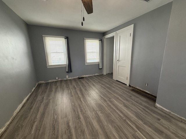 310 E Chippewa St, Dwight, IL 60420 - unfurnished bedroom with dark wood-style flooring and a ceiling fan