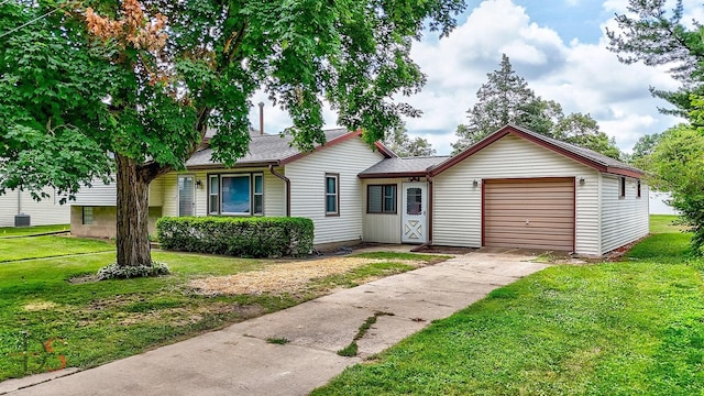 132 New St, Seneca, IL 61360 - tri-level home with a garage, a front lawn, driveway, and roof with shingles
