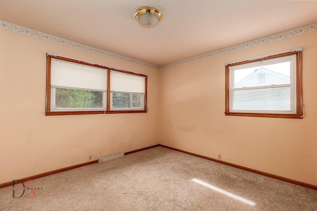 132 New St, Seneca, IL 61360 - empty room featuring light colored carpet and baseboards