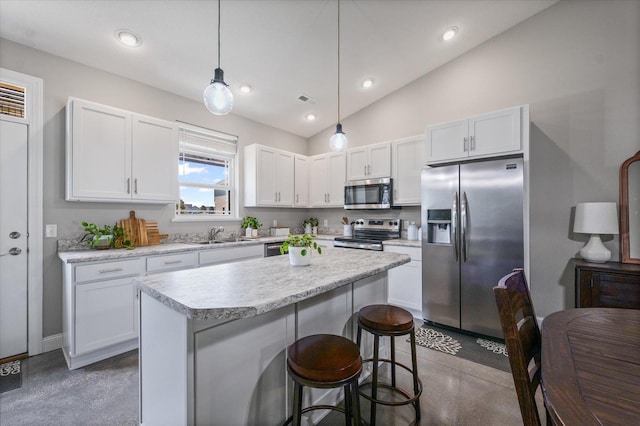 3013 E Stillwater Lndg Unit 3013, Urbana, IL 61802 - kitchen featuring stainless steel appliances, finished concrete flooring, light countertops, white cabinets, and a kitchen island