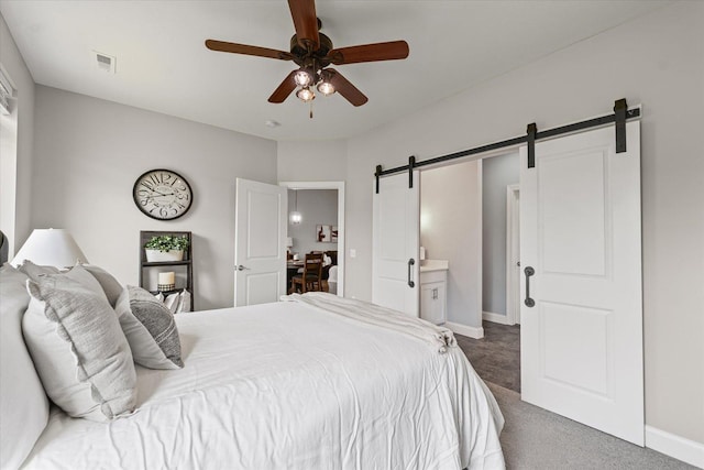 3013 E Stillwater Lndg Unit 3013, Urbana, IL 61802 - carpeted bedroom featuring a barn door and ceiling fan