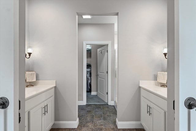 3013 E Stillwater Lndg Unit 3013, Urbana, IL 61802 - bathroom with vanity, a walk in closet, a stall shower, and stone finish flooring