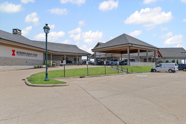 3013 E Stillwater Lndg Unit 3013, Urbana, IL 61802 - view of building exterior featuring covered and uncovered parking