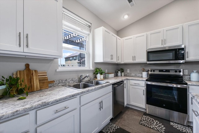 3013 E Stillwater Lndg Unit 3013, Urbana, IL 61802 - kitchen with appliances with stainless steel finishes, light countertops, white cabinetry, vaulted ceiling, and recessed lighting
