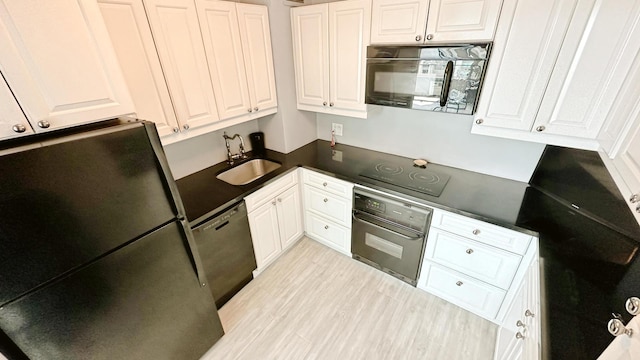 3600 N Lake Shore Dr Unit 2223, Chicago, IL 60613 - kitchen featuring black appliances, white cabinets, dark countertops, and light wood-style floors