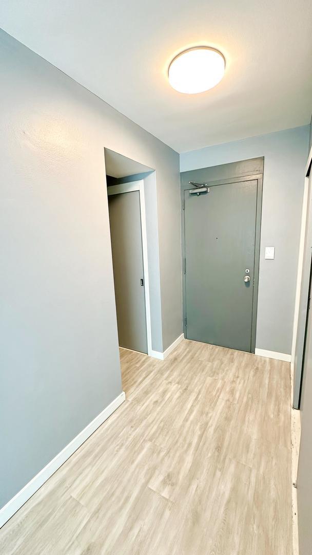 3600 N Lake Shore Dr Unit 2223, Chicago, IL 60613 - corridor with baseboards and light wood-type flooring