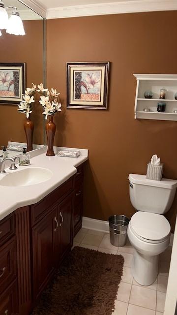 13216 N Country Club Ct Unit 2Aa, Palos Heights, IL 60463 - bathroom with vanity, tile patterned flooring, ornamental molding, and a chandelier