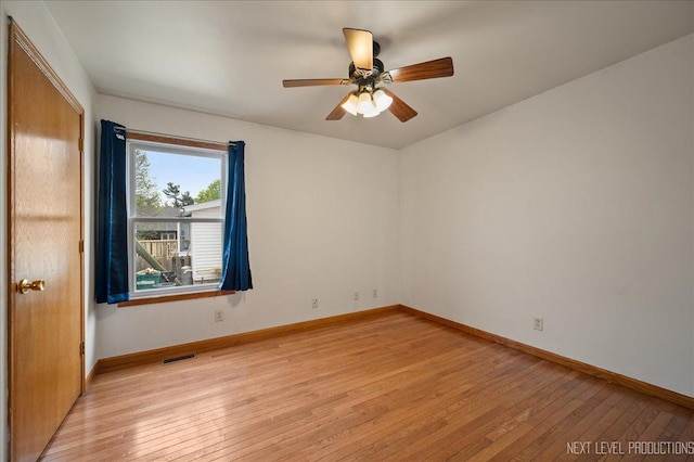 317 Plymouth Ct, Sycamore, IL 60178 - unfurnished room with light wood-style flooring and a ceiling fan