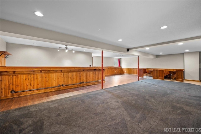 317 Plymouth Ct, Sycamore, IL 60178 - finished basement with wainscoting, wooden walls, wood finished floors, recessed lighting, and bar