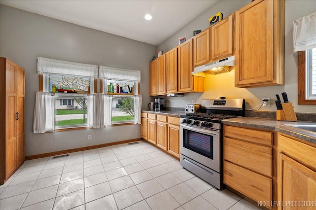 317 Plymouth Ct, Sycamore, IL 60178 - kitchen featuring stainless steel gas range, under cabinet range hood, dark countertops, light tile patterned flooring, and recessed lighting